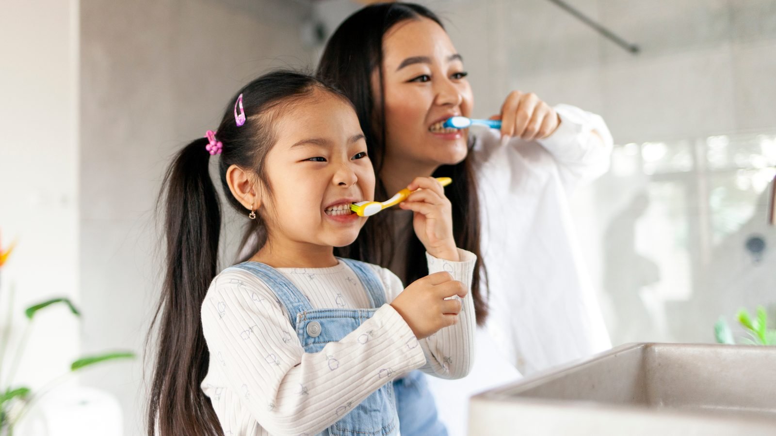A parent and child sharing morning brushing — care at every age